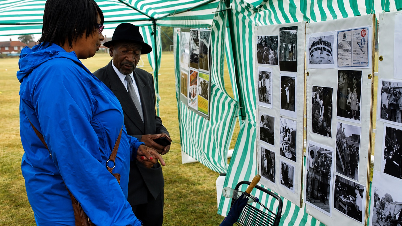 Visitors viewing a heritage display at a community event